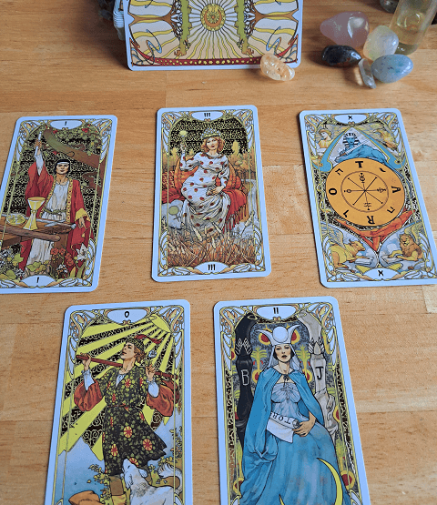 Image shows tarot cards in a spread to illustrate the tarot card meanings section